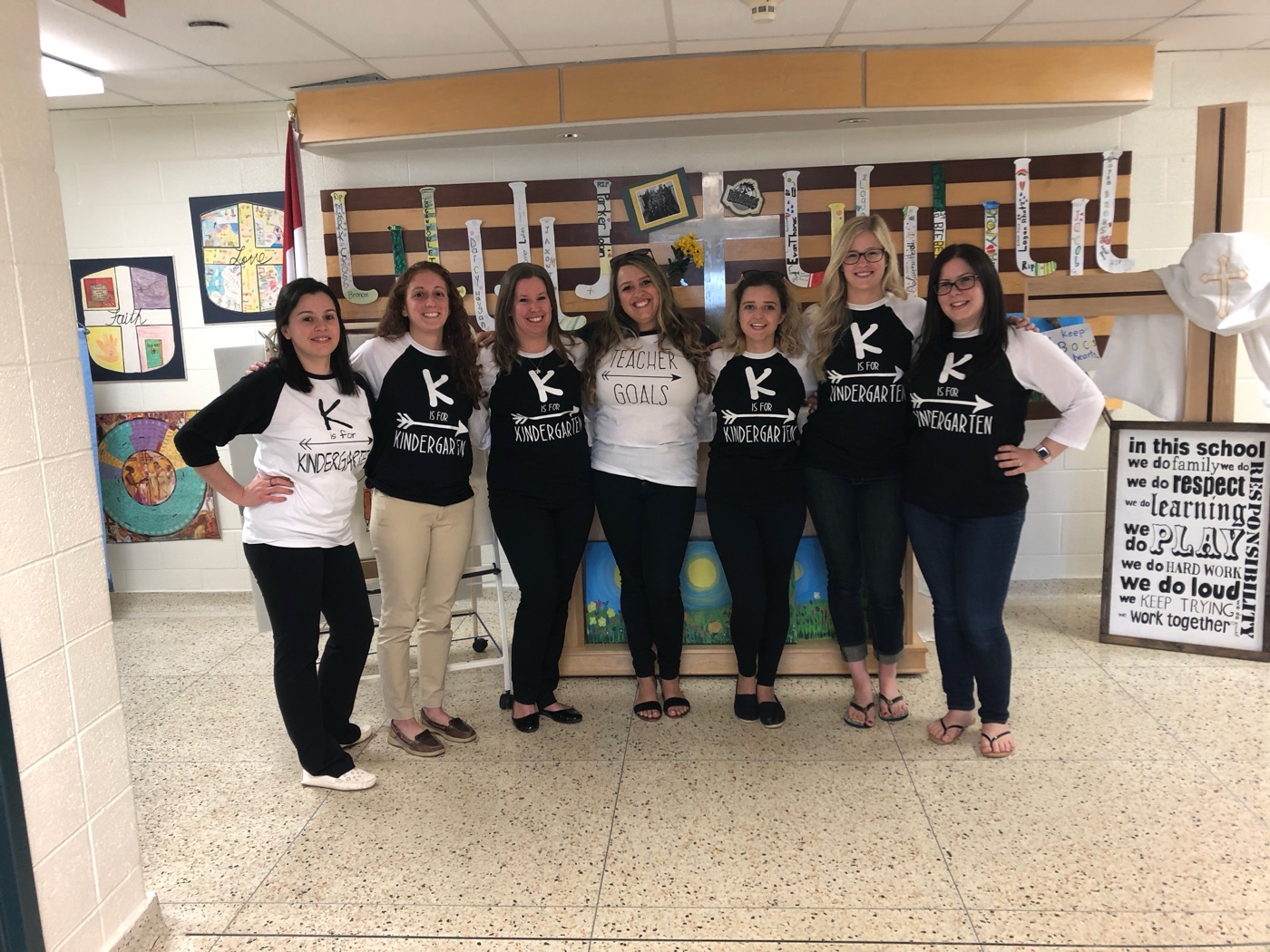 Danielle and six colleagues in matching kindergarten team shirts