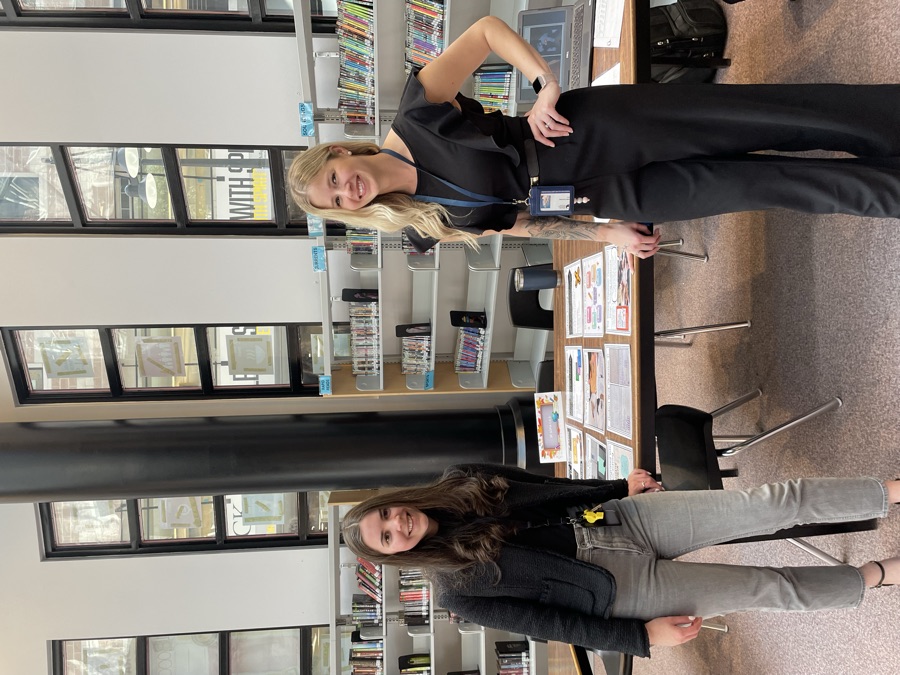 Danielle and a colleague presenting resources in the school library
